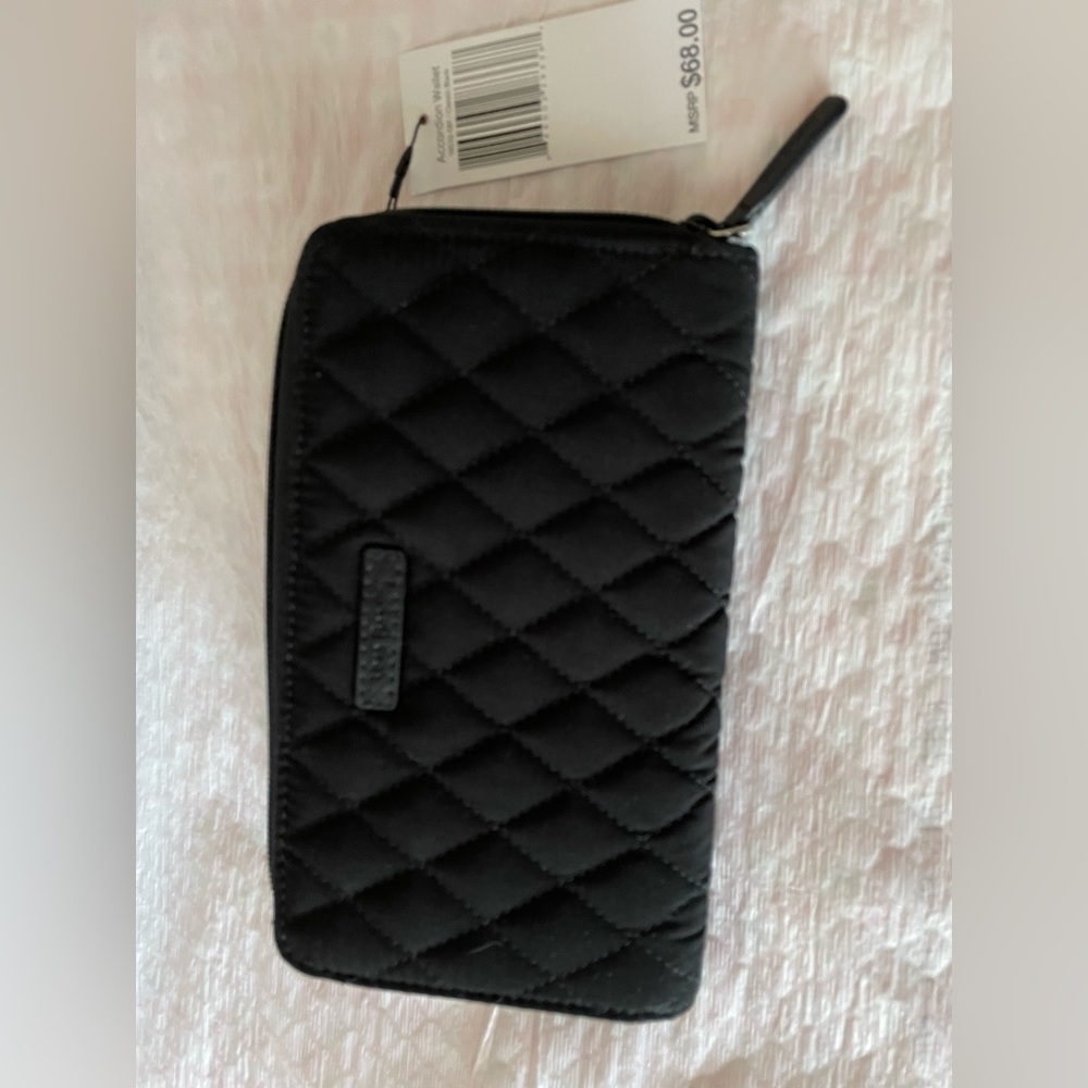 Vera zip around wallet
12 card slots 
Zip change section 
2 bill slots 
$15